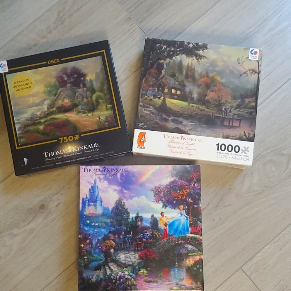 Set of 3 Thomas Kinkade Jigsaw Puzzles.